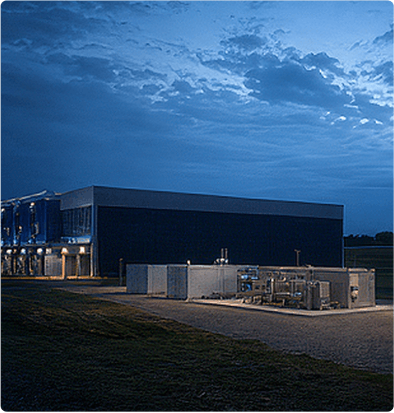Industrial facility with modular processing equipment, piping, and enclosed infrastructure, illustrating the deployment and integration of carbon capture technology to reduce CO₂ emissions from industrial operations.
