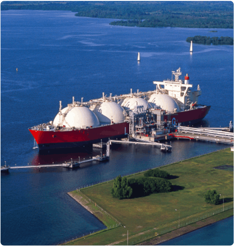 LNG carrier with large spherical storage tanks docked at a marine terminal, illustrating opportunities for carbon capture and emissions-reduction technologies to reduce CO₂ from large vessels and support cleaner maritime operations.